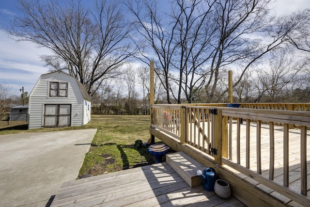 deck featuring a yard and an outdoor structure