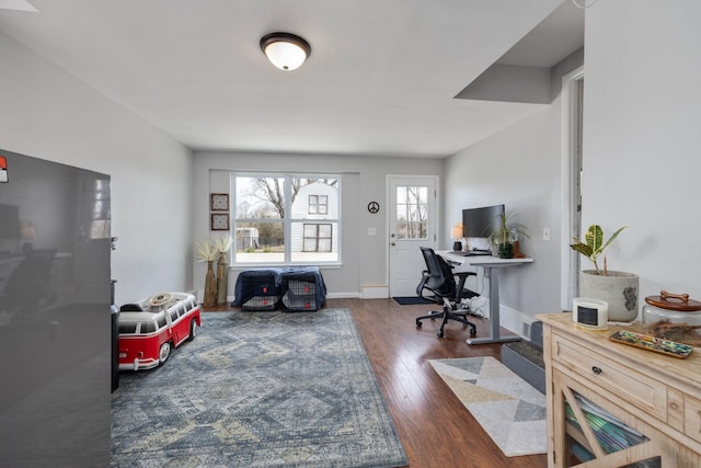 office featuring baseboards and wood-type flooring