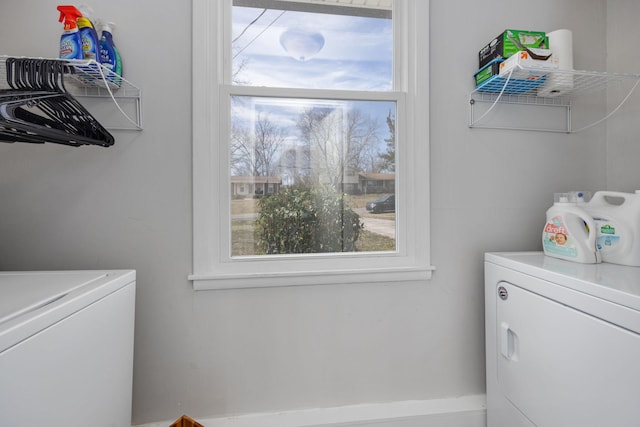 laundry area featuring a wealth of natural light, laundry area, and washing machine and dryer