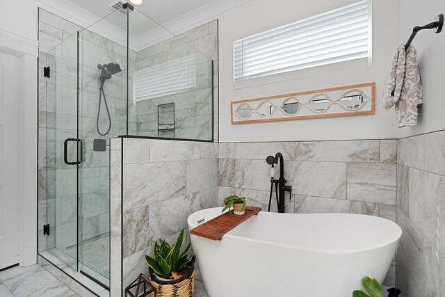 8858 Silver Maple Dr, Ooltewah, TN 37363 - full bathroom featuring a stall shower, marble finish floor, a freestanding bath, and tile walls