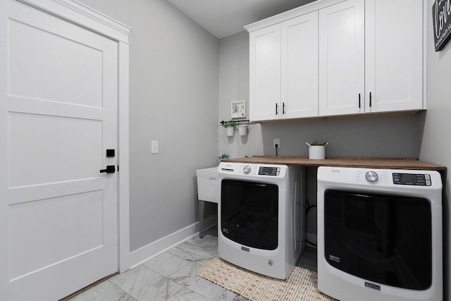 8858 Silver Maple Dr, Ooltewah, TN 37363 - laundry area featuring marble finish floor, cabinet space, washer and clothes dryer, and baseboards