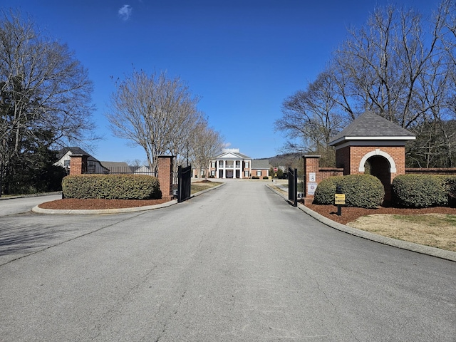 8858 Silver Maple Dr, Ooltewah, TN 37363 - view of road featuring curbs, a gated entry, and a gate