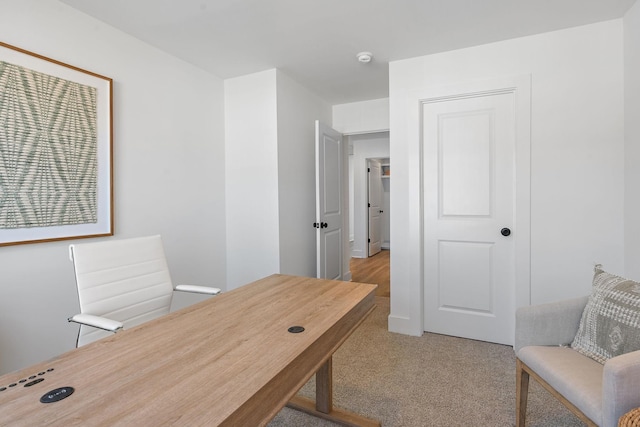 office area featuring light colored carpet