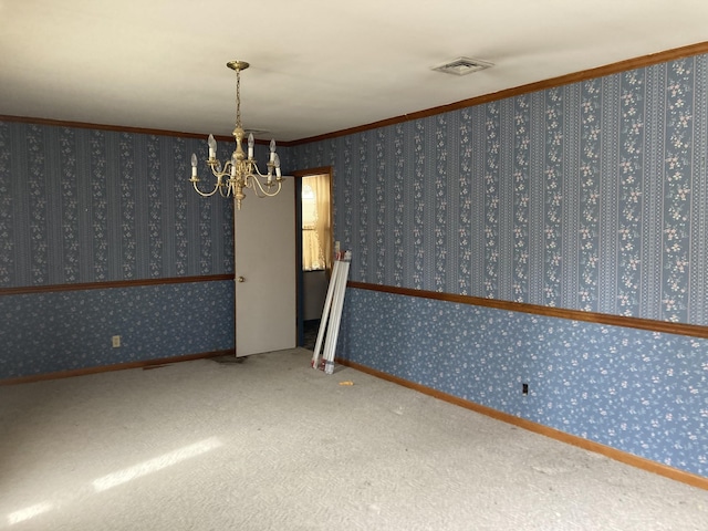 empty room featuring carpet, visible vents, an inviting chandelier, ornamental molding, and wallpapered walls