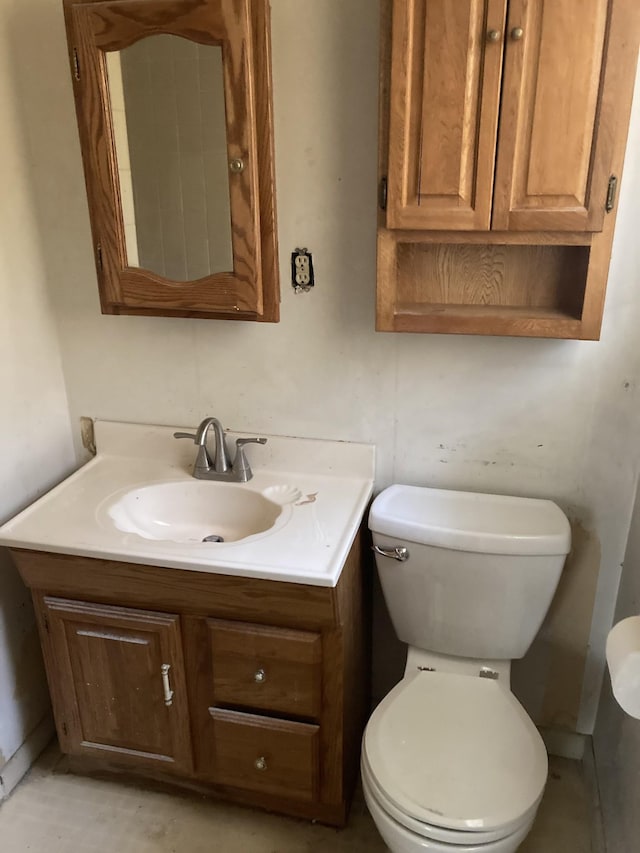 bathroom with toilet and vanity