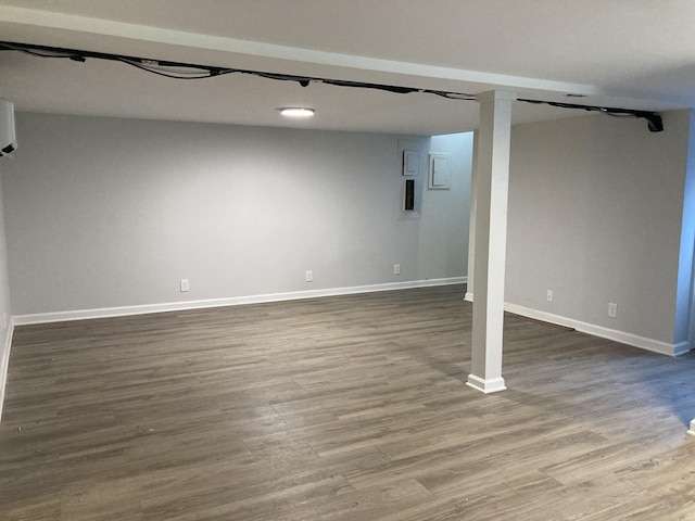 finished basement with dark wood finished floors and baseboards