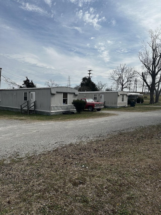 exterior space featuring gravel driveway