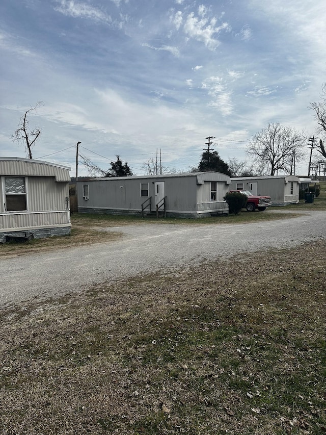 exterior space featuring gravel driveway