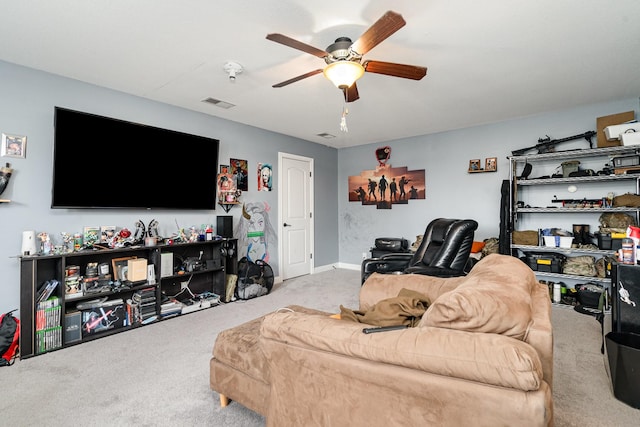 living room with carpet floors, visible vents, and a ceiling fan