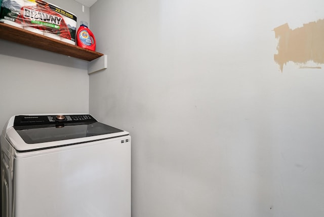 laundry room featuring washer / dryer and laundry area