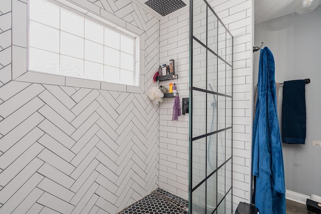 full bathroom with a tile shower