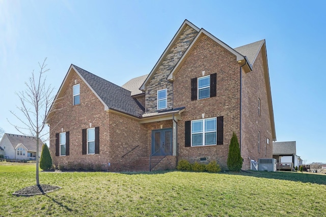 traditional home featuring crawl space, a front lawn, and brick siding