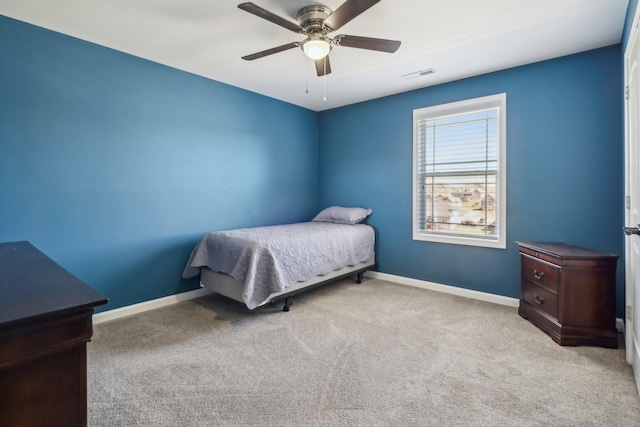 bedroom with carpet floors, baseboards, visible vents, and a ceiling fan