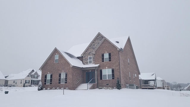 traditional-style house with cooling unit, crawl space, and brick siding