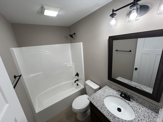 bathroom with toilet, shower / washtub combination, and vanity