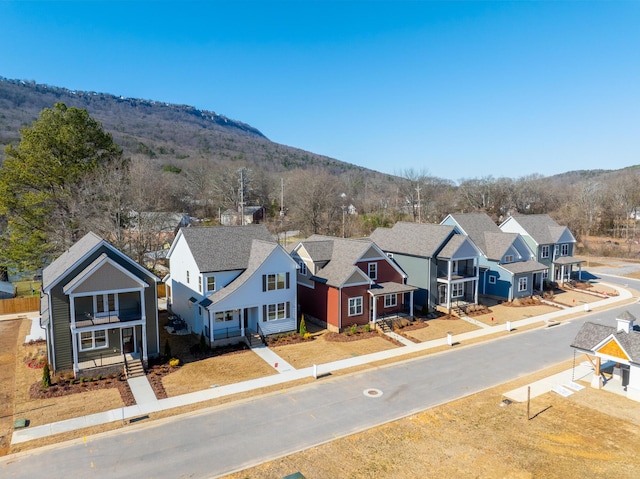 drone / aerial view featuring a mountain view and a residential view