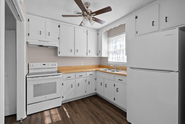 kitchen featuring dark wood-style floors, white cabinetry, a sink, white appliances, and under cabinet range hood