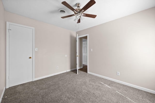 unfurnished bedroom with a ceiling fan, carpet, visible vents, and baseboards