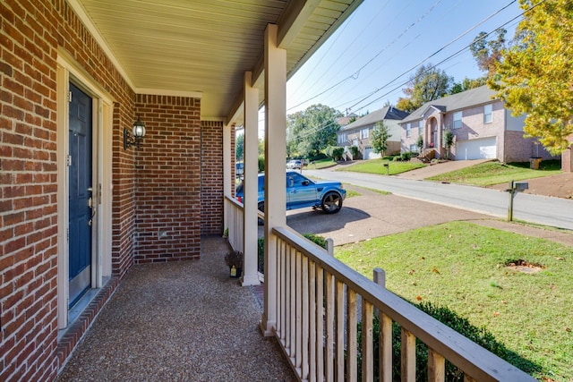 balcony with a residential view and covered porch