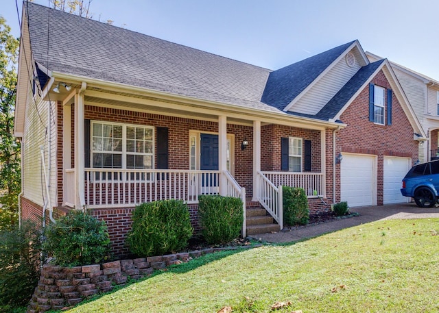 view of front of property featuring covered porch, roof with shingles, driveway, and brick siding