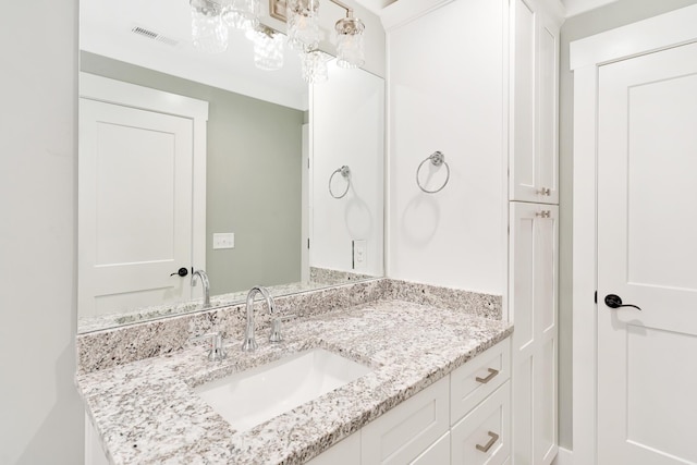 bathroom with vanity and visible vents