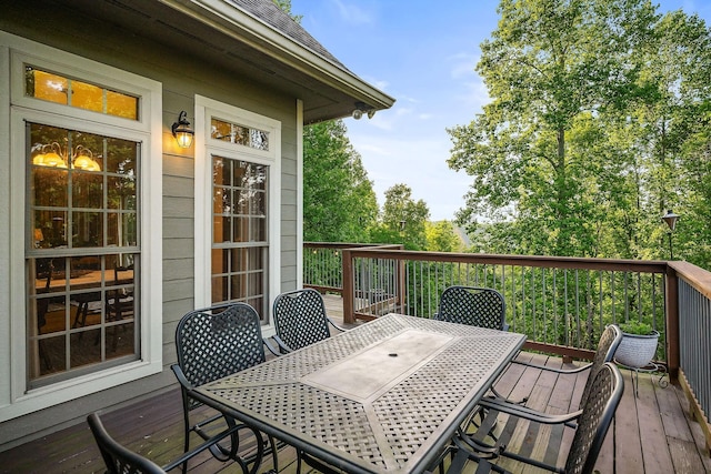 wooden deck featuring outdoor dining space