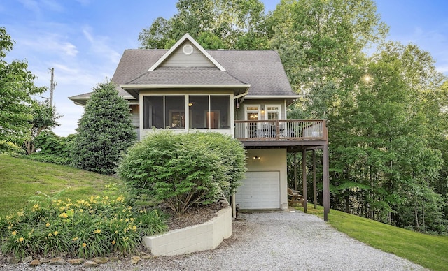 view of front facade with driveway, a shingled roof, a garage, and a front yard