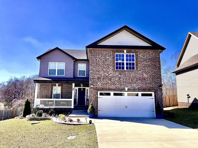 view of front of home with brick siding, an attached garage, a front lawn, fence, and driveway