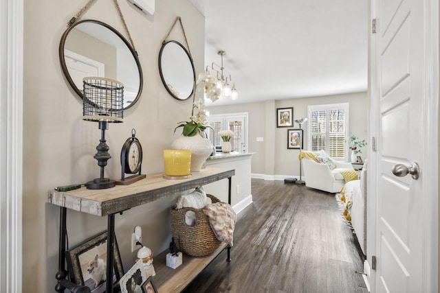 interior space with baseboards and dark wood-style flooring