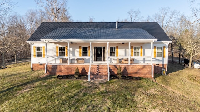 rear view of property with a yard, covered porch, a ceiling fan, crawl space, and metal roof