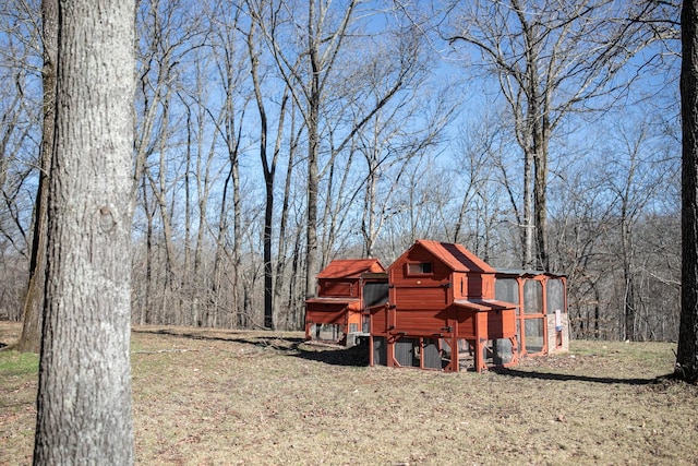 view of yard with an outbuilding and exterior structure