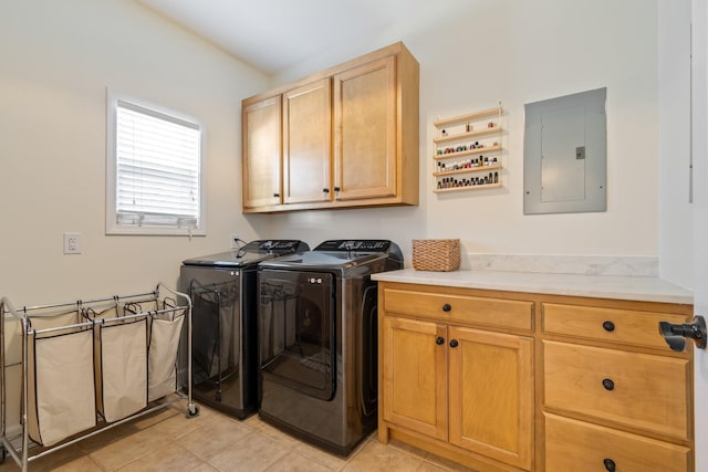 clothes washing area featuring cabinet space, washing machine and dryer, electric panel, and light tile patterned floors