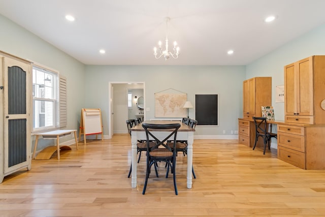 dining space with light wood-type flooring, baseboards, a notable chandelier, and recessed lighting