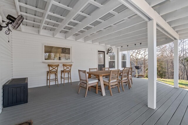 wooden deck with outdoor dining space