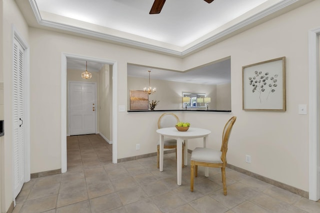 dining room with light tile patterned floors, baseboards, and ceiling fan with notable chandelier