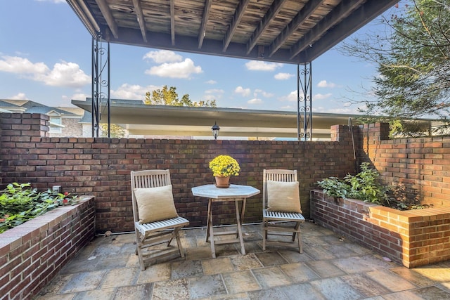 view of patio / terrace featuring fence