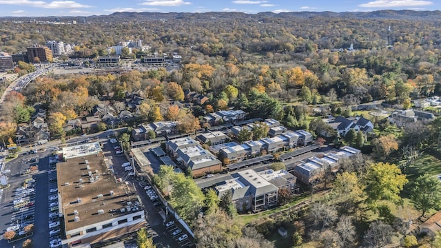 birds eye view of property with a view of trees