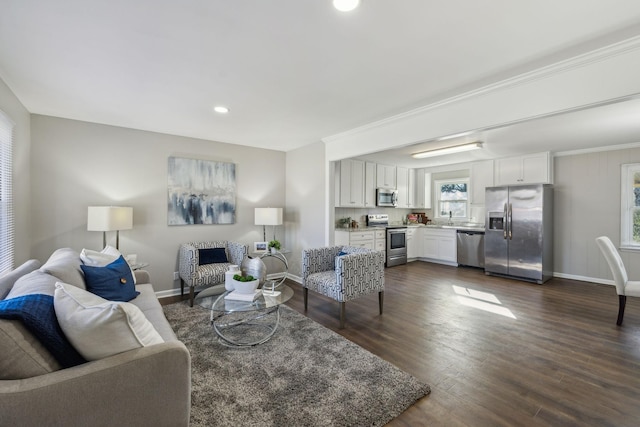 living room featuring crown molding, recessed lighting, dark wood finished floors, and baseboards