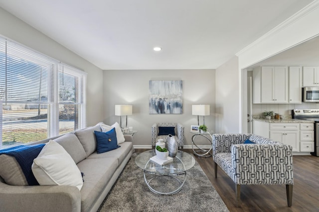 living room with baseboards, dark wood finished floors, and recessed lighting