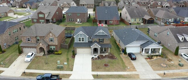 birds eye view of property with a residential view