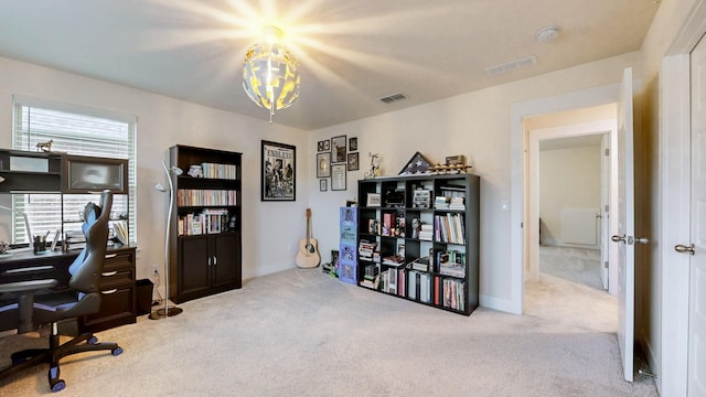 office area with visible vents and carpet flooring