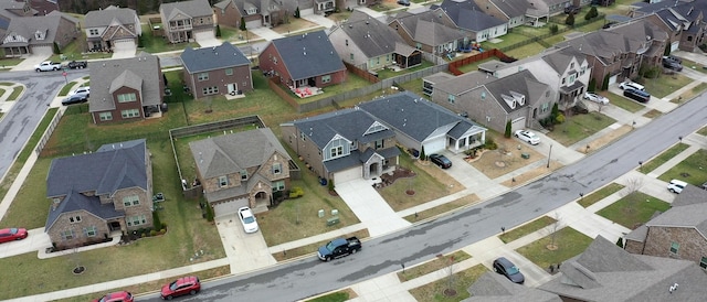 birds eye view of property with a residential view