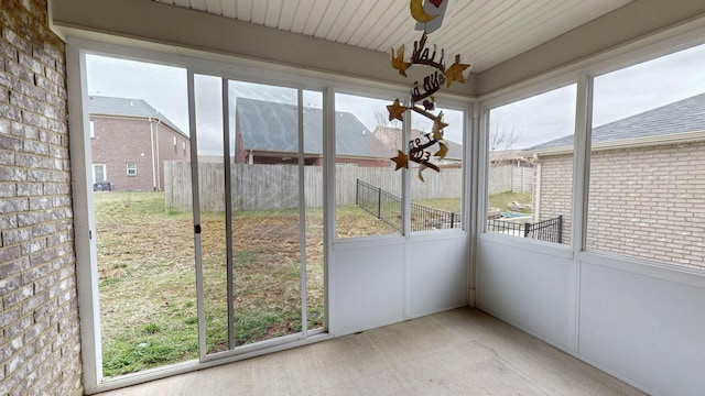 unfurnished sunroom featuring a wealth of natural light