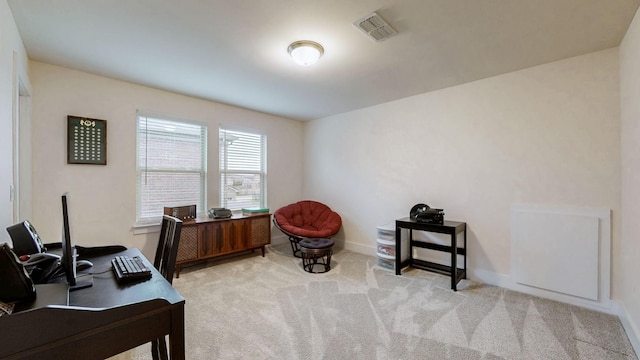 office with carpet floors, visible vents, and baseboards