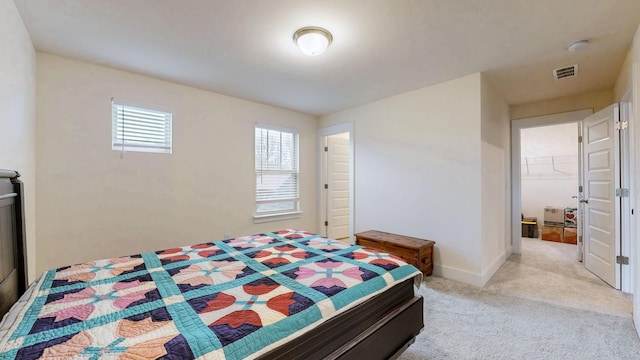 bedroom featuring carpet floors, visible vents, and baseboards