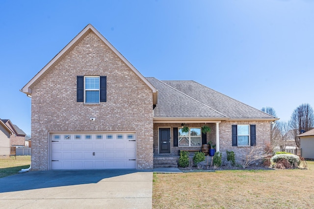 traditional-style house with concrete driveway, brick siding, an attached garage, and a front lawn