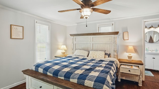 bedroom with ornamental molding, multiple windows, dark wood finished floors, and baseboards