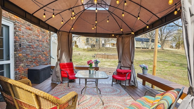 view of patio / terrace featuring a gazebo and a wooden deck