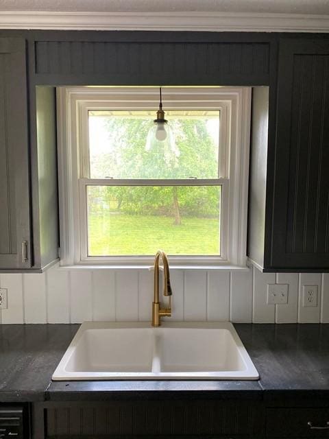 interior space featuring dark countertops and a sink