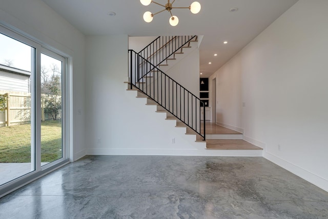 stairway featuring an inviting chandelier, concrete floors, baseboards, and recessed lighting